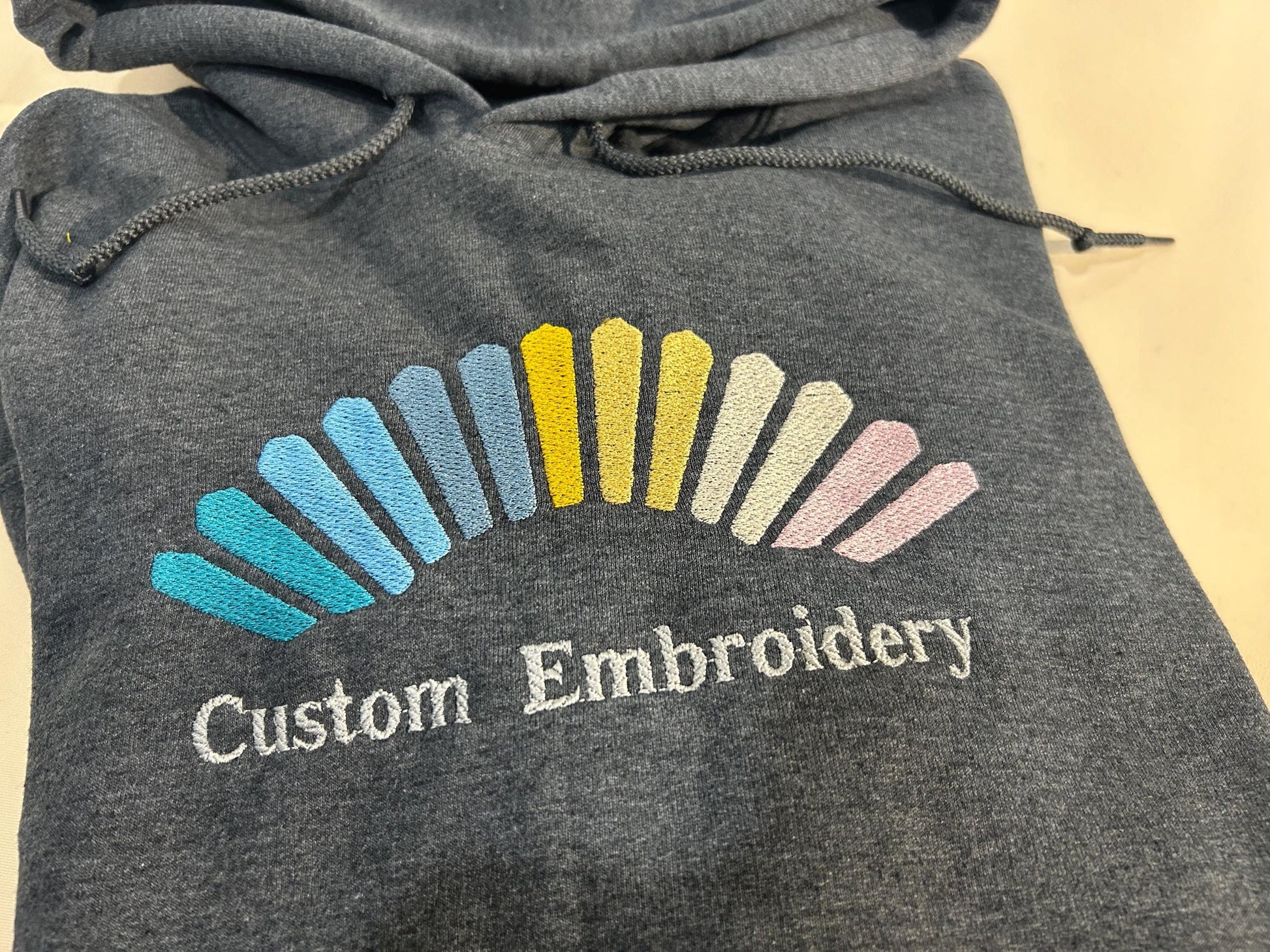 Custom embroidered hoodie - personalized with and/or text - for business, sports teams and special occasion gifts.