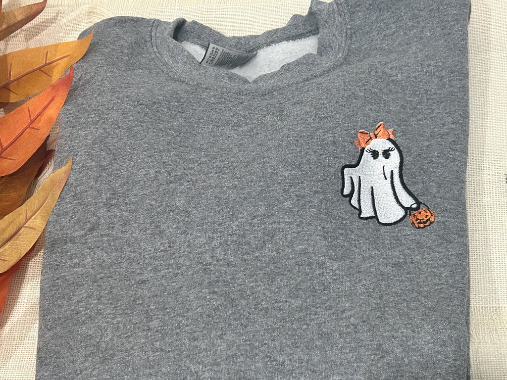ghost holding beer and pumpkin sweatshirt